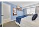 Bright bedroom with large bed, TV, and dresser and access to en-suite bathroom at 5511 N Ocean Blvd. # 203, Myrtle Beach, SC 29577