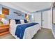 Comfortable bedroom with nautical decor, soft lighting, and ample closet space at 5511 N Ocean Blvd. # 203, Myrtle Beach, SC 29577