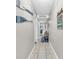 Hallway featuring nautical decor and tile flooring leading to a cozy living area at 5511 N Ocean Blvd. # 203, Myrtle Beach, SC 29577