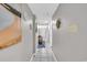 Inviting hallway with coastal decor, tiled floors, and access to various rooms in the home at 5511 N Ocean Blvd. # 203, Myrtle Beach, SC 29577
