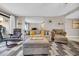 Comfortable living room with a neutral color palette, ample seating, and sliding glass doors to a patio at 5511 N Ocean Blvd. # 203, Myrtle Beach, SC 29577