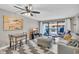 Comfortable living room with a ceiling fan and sliding glass doors leading to an outdoor patio at 5511 N Ocean Blvd. # 203, Myrtle Beach, SC 29577
