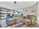 Comfortable living room featuring stylish flooring, modern decor, and balcony access at 5511 N Ocean Blvd. # 203, Myrtle Beach, SC 29577