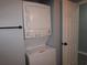 Bathroom showing washer and dryer with a shower/tub combination to the left at 573 Blue River Ct. # 8-H, Myrtle Beach, SC 29579