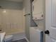 Bathroom featuring a tub/shower and a stackable washer/dryer combination at 573 Blue River Ct. # 8-H, Myrtle Beach, SC 29579