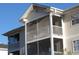 Upper view of the condo featuring multiple screened porches, ideal for enjoying outdoor living at 573 Blue River Ct. # 8-H, Myrtle Beach, SC 29579
