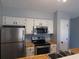 Bright kitchen featuring stainless steel appliances, white cabinets, and butcher block countertops at 573 Blue River Ct. # 8-H, Myrtle Beach, SC 29579