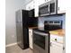 Well-lit kitchen featuring butcher block countertops, stainless steel appliances and white cabinetry at 573 Blue River Ct. # 8-H, Myrtle Beach, SC 29579