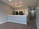 Open-concept living space features modern flooring, neutral paint, and recessed lighting adjacent to the kitchen at 573 Blue River Ct. # 8-H, Myrtle Beach, SC 29579