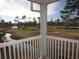 View from the covered patio looks out to the golf course and a winding pond with mature trees at 573 Blue River Ct. # 8-H, Myrtle Beach, SC 29579