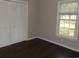 Bedroom with wood floors, closet, and window at 9500 Indigo Creek Blvd., Murrells Inlet, SC 29576