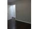 Bedroom with wood floors and a door leading to another room at 9500 Indigo Creek Blvd., Murrells Inlet, SC 29576