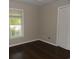 Bedroom featuring hardwood floors, a window, and closet space at 9500 Indigo Creek Blvd., Murrells Inlet, SC 29576