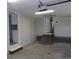 Bright garage featuring white walls, brick accents, and access to a laundry area at 9500 Indigo Creek Blvd., Murrells Inlet, SC 29576