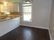 Bright kitchen area with wood floors, ample natural light, and neutral paint at 9500 Indigo Creek Blvd., Murrells Inlet, SC 29576