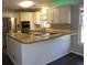 Modern kitchen with stainless steel appliances, granite countertops, and a breakfast bar at 9500 Indigo Creek Blvd., Murrells Inlet, SC 29576