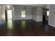 Open-concept living area with hardwood floors, wainscoting, and plenty of natural light at 9500 Indigo Creek Blvd., Murrells Inlet, SC 29576