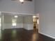 Bright living room with hardwood floors and views into the kitchen area at 9500 Indigo Creek Blvd., Murrells Inlet, SC 29576