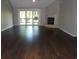 Spacious living room with fireplace and sliding glass doors to the outside at 9500 Indigo Creek Blvd., Murrells Inlet, SC 29576