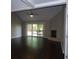 Well-lit living area with a fireplace and glass doors to the exterior at 9500 Indigo Creek Blvd., Murrells Inlet, SC 29576