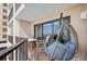 Cozy balcony featuring a hanging chair and seating, with serene views of the ocean and coastal surroundings at 6200 N Ocean Blvd. # 203, North Myrtle Beach, SC 29582