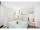 Inviting bedroom with soft lighting and beach themed art, creating a serene retreat at 6200 N Ocean Blvd. # 203, North Myrtle Beach, SC 29582
