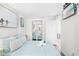 Comfortable bedroom with a large bed, mirrored closet, and a TV for relaxing evenings at 6200 N Ocean Blvd. # 203, North Myrtle Beach, SC 29582