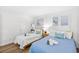 Cozy bedroom featuring two twin beds with ocean-themed décor and comfy furnishings at 6200 N Ocean Blvd. # 203, North Myrtle Beach, SC 29582