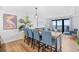 Dining room features stylish lighting, seating for six, and panoramic ocean views at 6200 N Ocean Blvd. # 203, North Myrtle Beach, SC 29582
