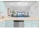 Well-equipped kitchen with stainless steel appliances and breakfast bar overlooking the dining area at 6200 N Ocean Blvd. # 203, North Myrtle Beach, SC 29582