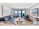 Inviting living room offering comfortable seating, hardwood floors, and a picturesque ocean view through the sliding glass doors at 6200 N Ocean Blvd. # 203, North Myrtle Beach, SC 29582