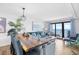 Bright living room boasting contemporary coastal decor and a stunning ocean view from the large sliding glass doors at 6200 N Ocean Blvd. # 203, North Myrtle Beach, SC 29582