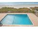 Inviting pool area showcasing clear blue water, marked depths, and ocean views at 6200 N Ocean Blvd. # 203, North Myrtle Beach, SC 29582