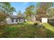 Exterior shot showing a backyard with a picnic table and a storage shed at 634 Melody Ln., Surfside Beach, SC 29575
