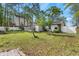 The backyard has a white fence and a small structure with a screened room addition at 634 Melody Ln., Surfside Beach, SC 29575