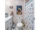 Standard bathroom showcasing the toilet, shower with beach themed curtain and vanity at 634 Melody Ln., Surfside Beach, SC 29575