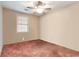 Modest bedroom featuring a ceiling fan and a window at 634 Melody Ln., Surfside Beach, SC 29575