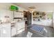 Multi-purpose bonus room with a small kitchen area, storage, and natural light from multiple windows at 634 Melody Ln., Surfside Beach, SC 29575