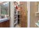 A walk-in closet is stocked with belongings and features an interesting bamboo curtain at 634 Melody Ln., Surfside Beach, SC 29575