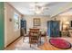 This dining room features hardwood floors, a ceiling fan, and a window for ample natural light at 634 Melody Ln., Surfside Beach, SC 29575