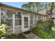 A close up of the front entrance showing the door and the enclosed porch of the charming home at 634 Melody Ln., Surfside Beach, SC 29575