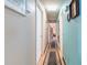 Hallway with hardwood floors, and access to storage at 634 Melody Ln., Surfside Beach, SC 29575