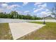 Spacious backyard area features a basketball court and a well-maintained perimeter fence at 6392 Highway 378, Conway, SC 29527