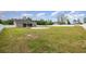 Large backyard surrounded by a white privacy fence and featuring a well-maintained lawn at 6392 Highway 378, Conway, SC 29527