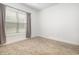 Bedroom with neutral carpet, bright window, and gray curtains to provide lots of natural light at 6392 Highway 378, Conway, SC 29527