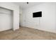Simple bedroom featuring wall-mounted TV, and access to a closet and the attached bathroom at 6392 Highway 378, Conway, SC 29527