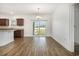 Bright dining area featuring hardwood floors and sliding glass doors to the backyard at 6392 Highway 378, Conway, SC 29527
