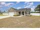 Cozy home with a well manicured lawn, an attached garage, and inviting entrance at 6392 Highway 378, Conway, SC 29527