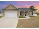 Charming home featuring a manicured lawn, attached garage, and a welcoming front entrance at 6392 Highway 378, Conway, SC 29527