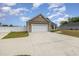 Spacious garage with an expansive driveway and a well-maintained exterior at 6392 Highway 378, Conway, SC 29527